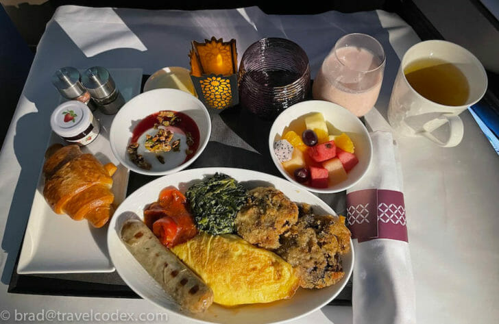 a plate of food and drinks on a table