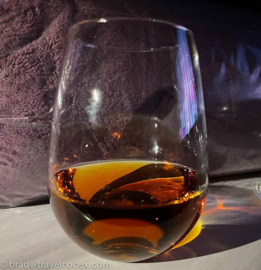a glass of brown liquid