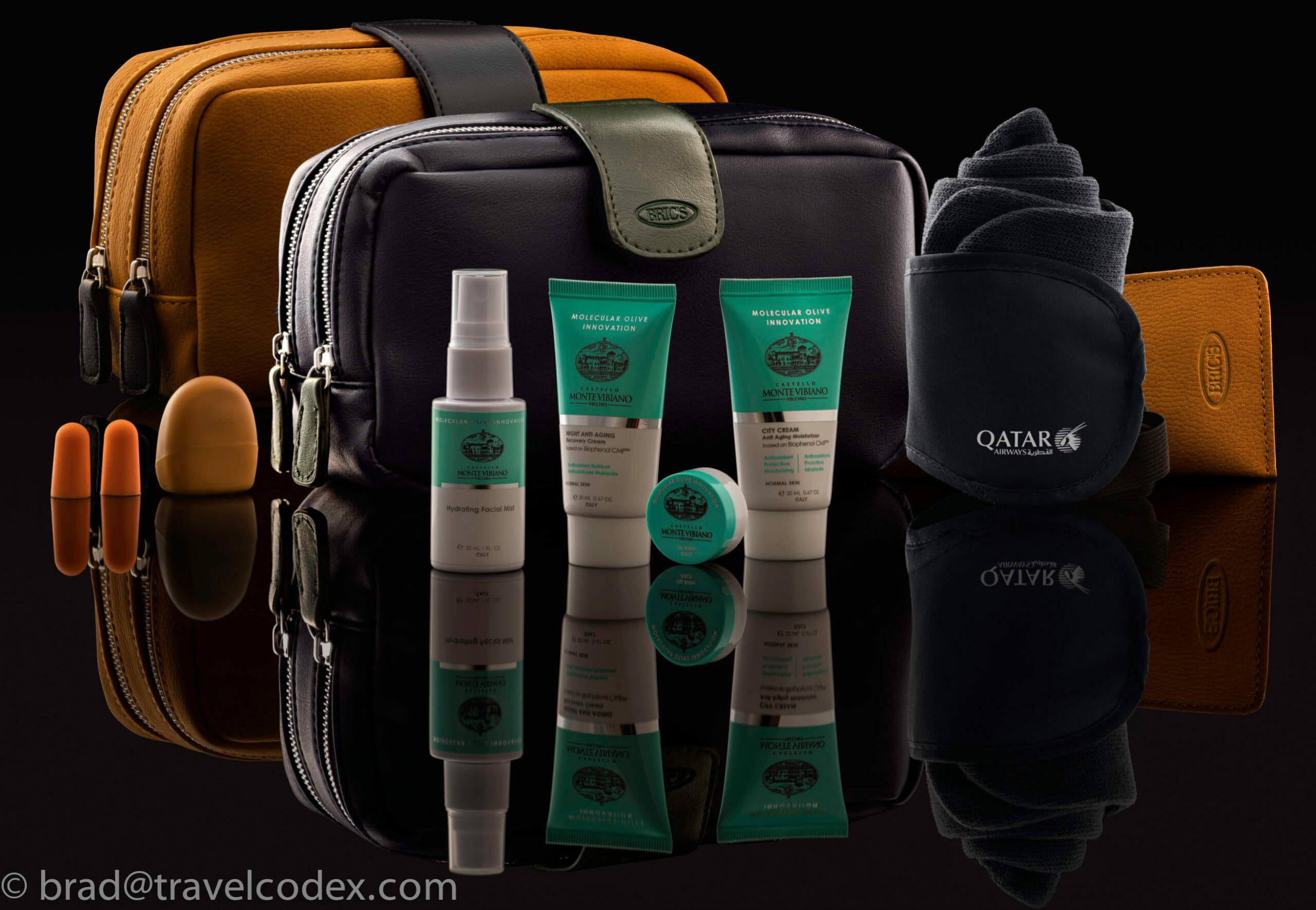 a group of travel items on a black surface