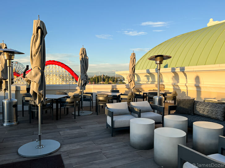 a patio with chairs and umbrellas