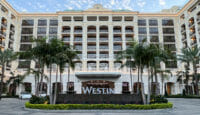 a building with palm trees