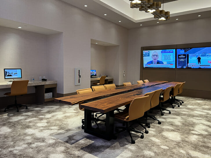 a conference room with a table and chairs