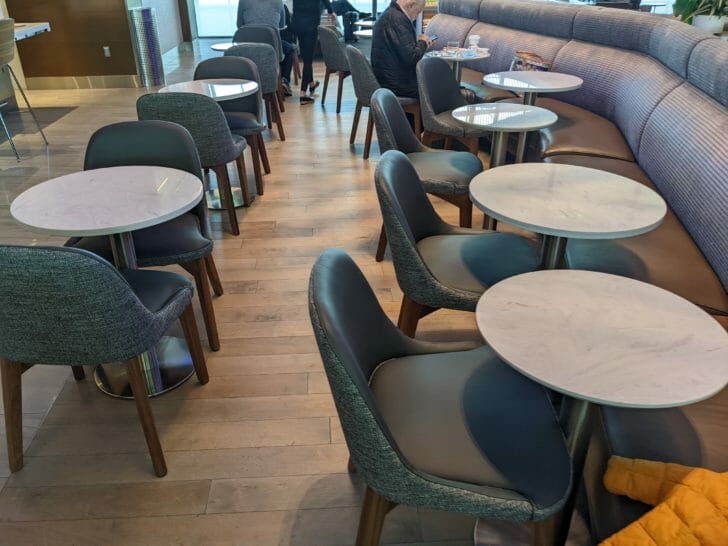 a group of tables and chairs in a restaurant