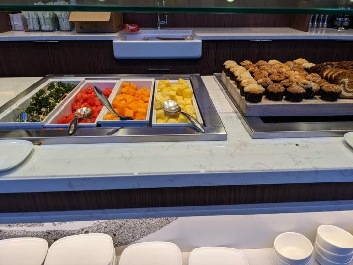 food on a counter with a glass shelf