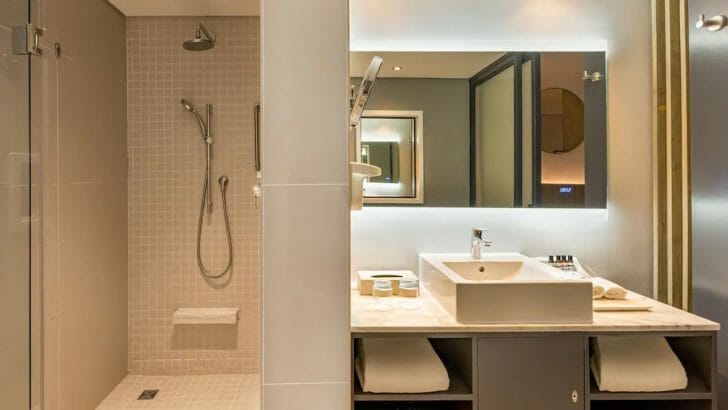 a bathroom with a shower and sink