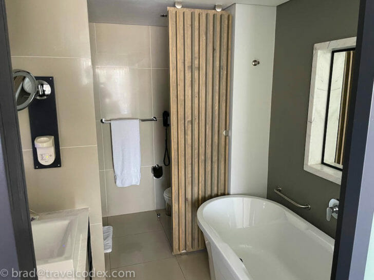 a bathroom with a tub and sink