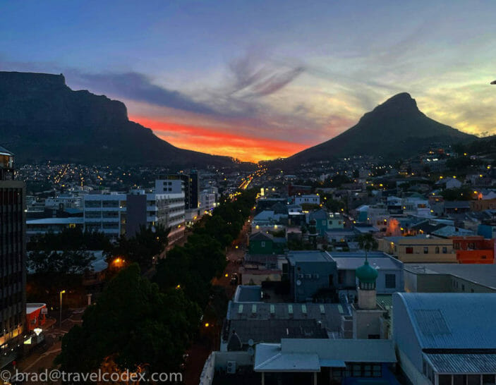 a city with a mountain in the background