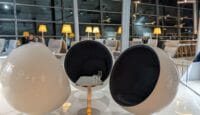a group of chairs and tables in a room