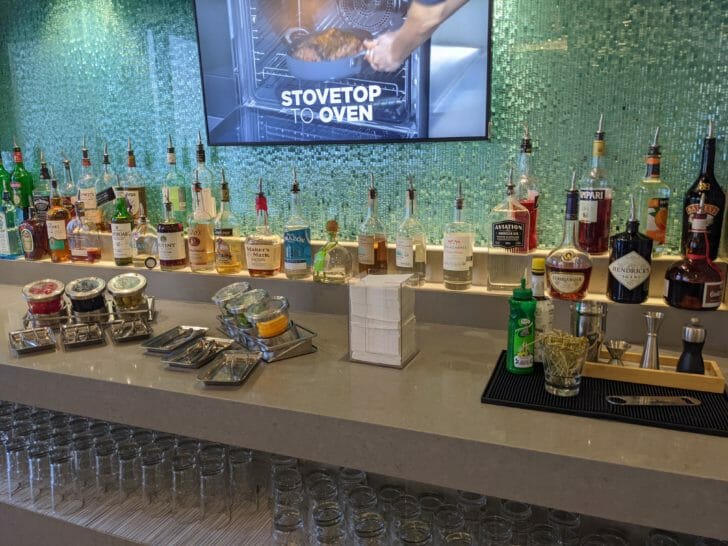 a bar with bottles and glasses