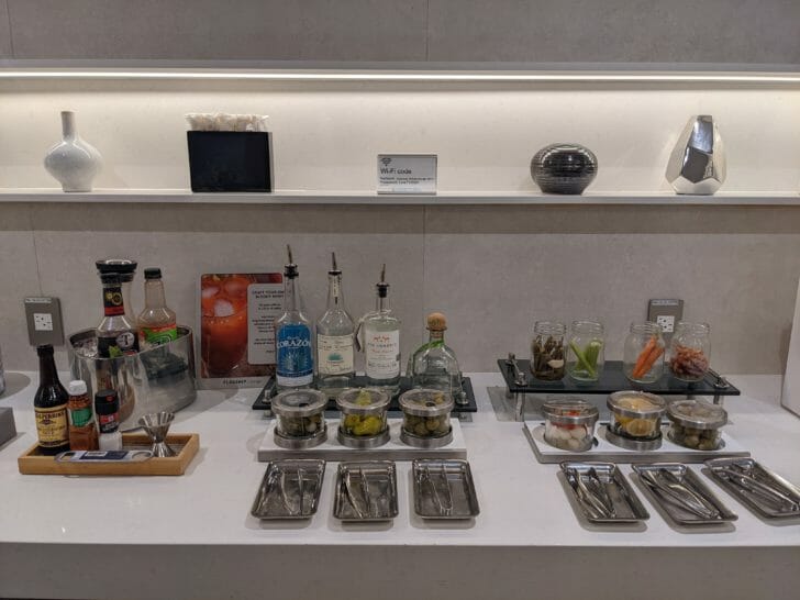 a counter with food and utensils on it