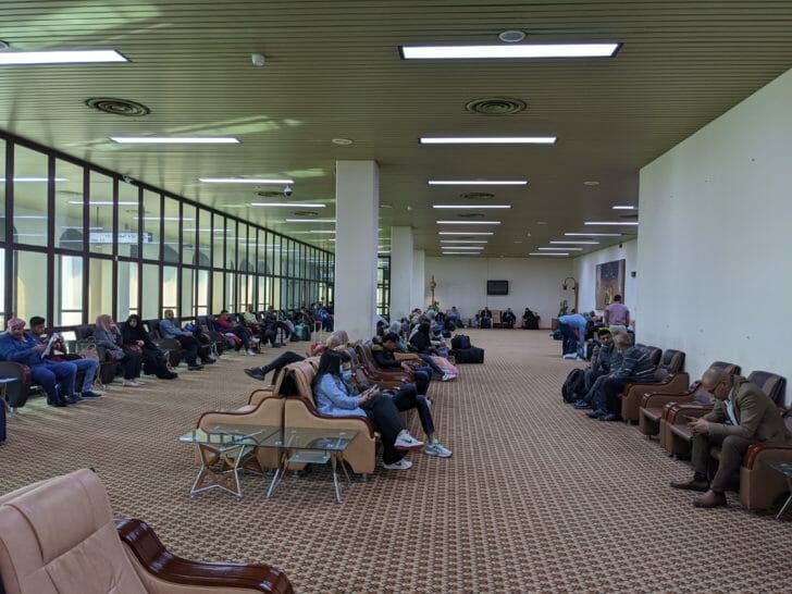 a group of people sitting in chairs in a room