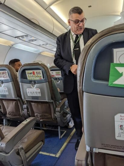 a man standing in an airplane