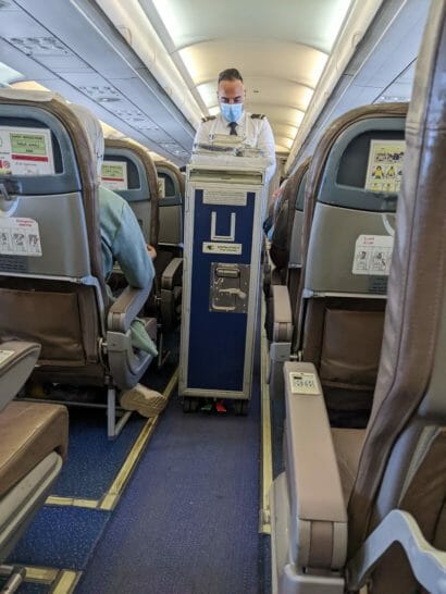 a person wearing a mask on a plane