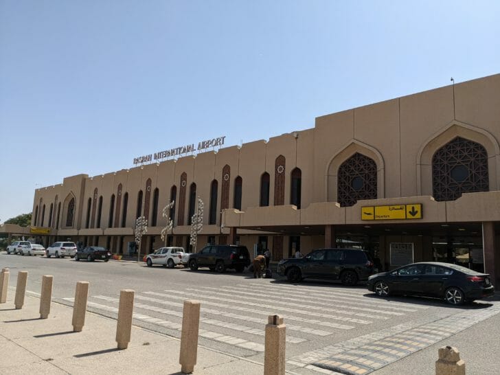 a building with cars parked in front of it