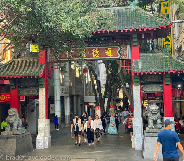a group of people walking through a street