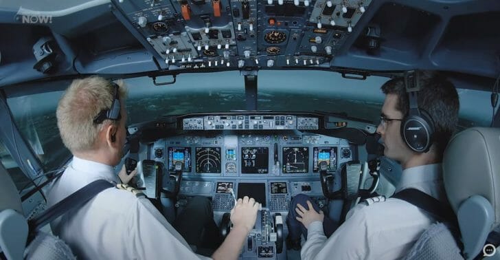a couple of pilots in a cockpit
