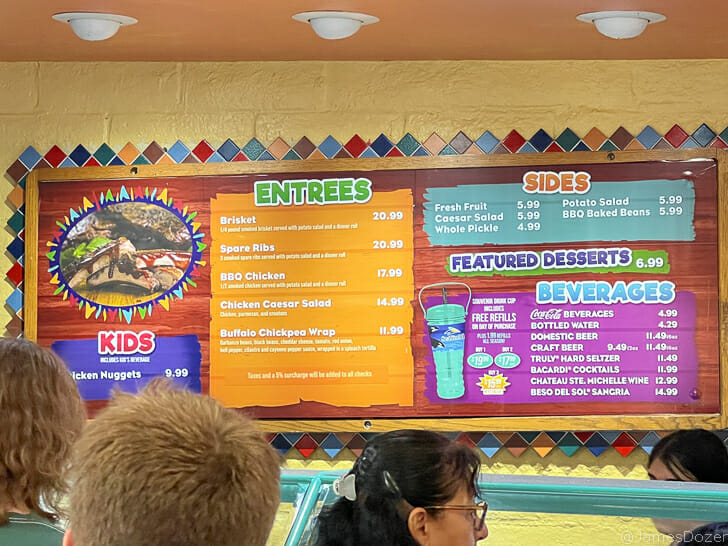 a menu board with colorful text and pictures