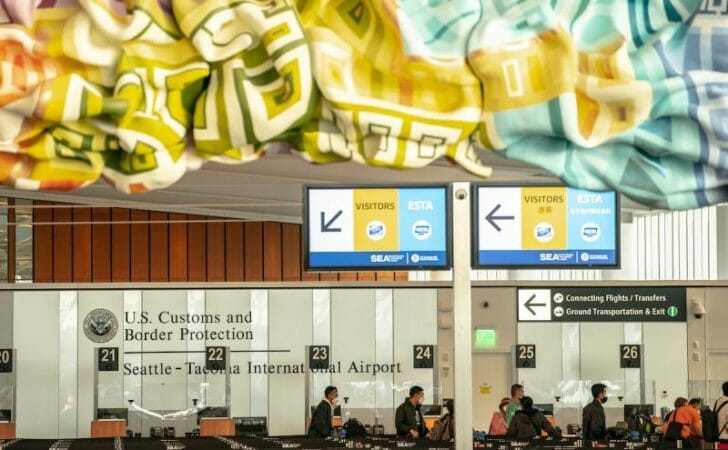 a group of people sitting in an airport
