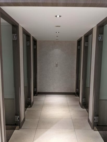 a hallway with doors and a light on the ceiling