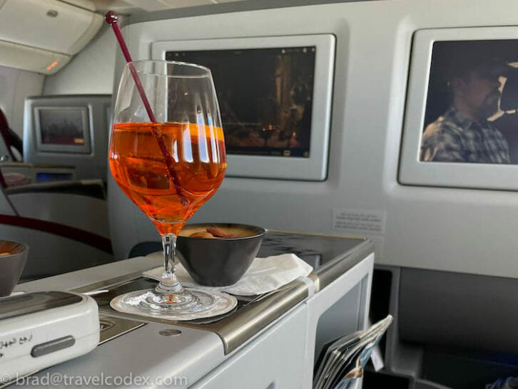 a glass of orange liquid on a table