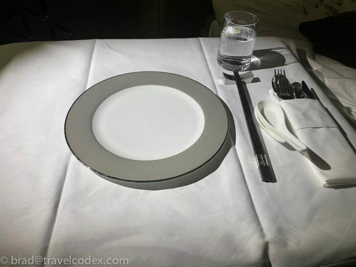 a plate and spoons on a table
