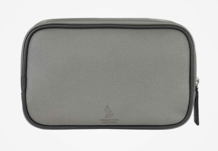 a grey bag with black trim