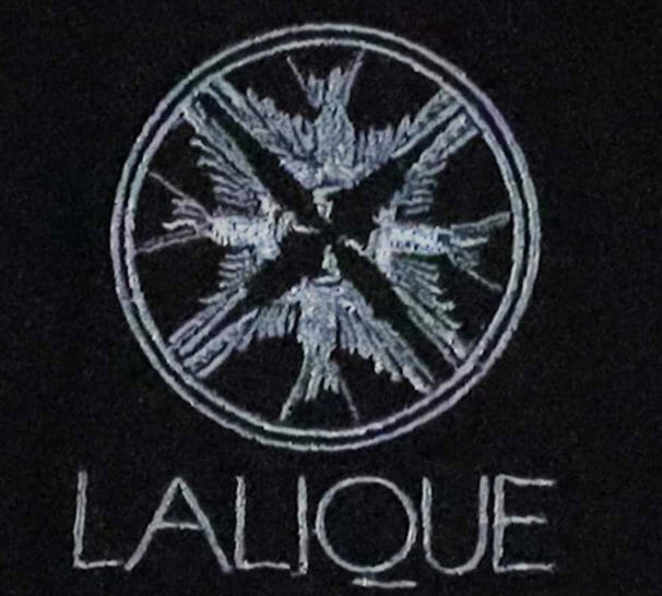 a logo on a black surface