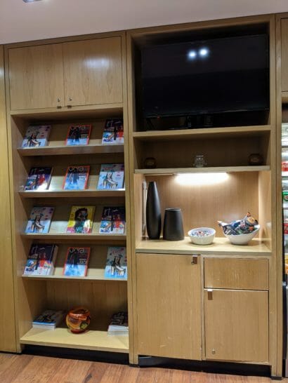 a shelf with books and a television
