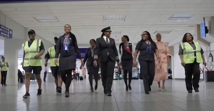 a group of women in uniform walking