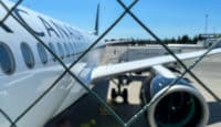 a plane behind a fence