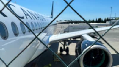 a plane behind a fence