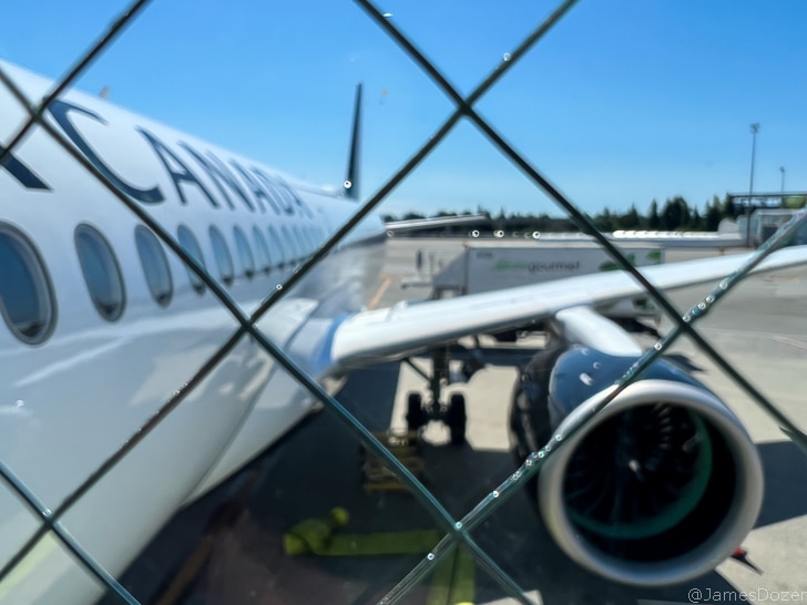 a plane behind a fence