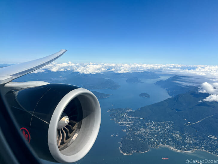 an airplane wing and engine above water