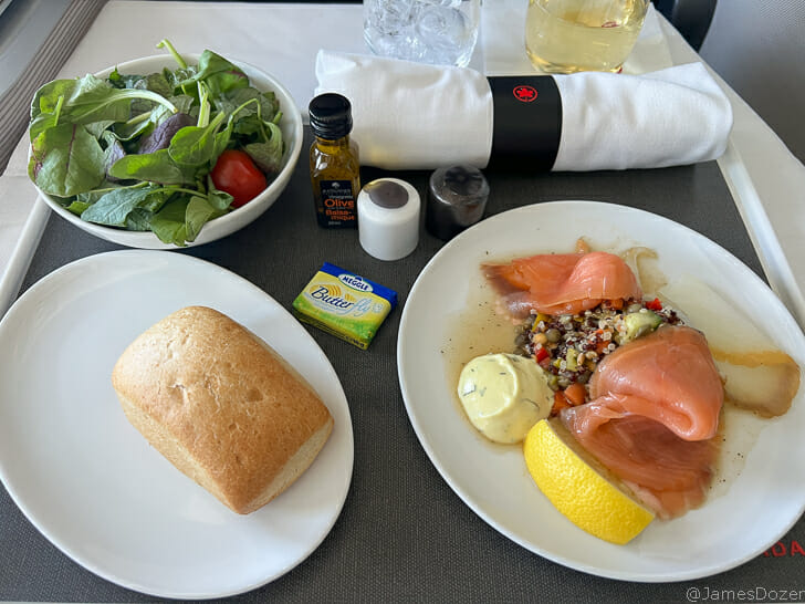 a plate of food and a salad on a table
