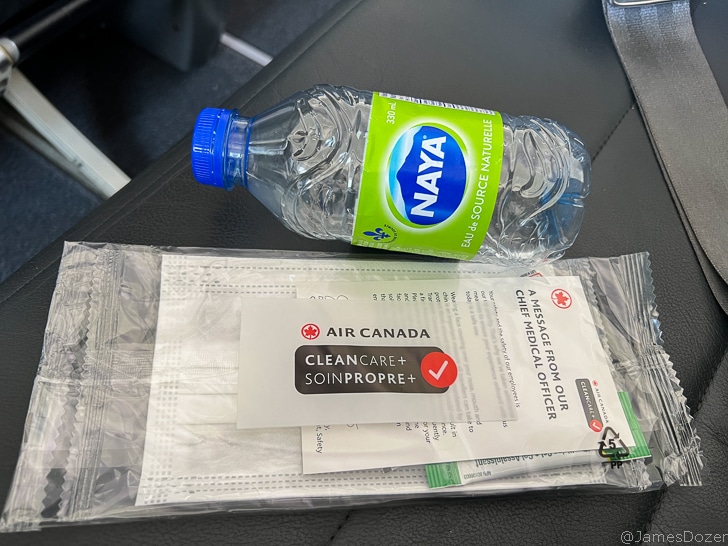 a bottle and face masks on a chair