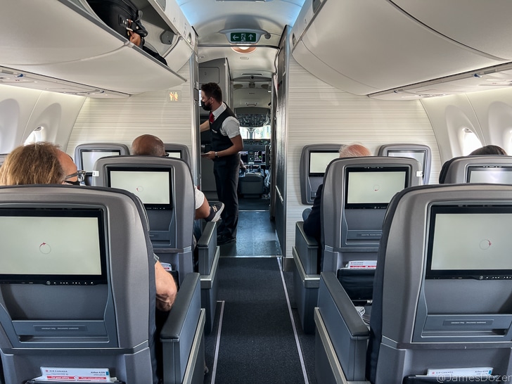 a group of people sitting in an airplane