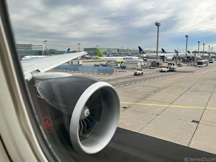 an airplane wing and engine on a runway