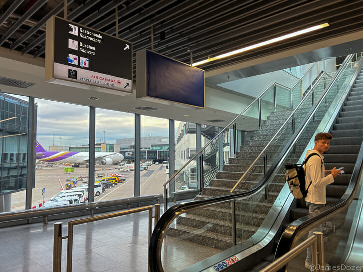 a man standing on an escalator