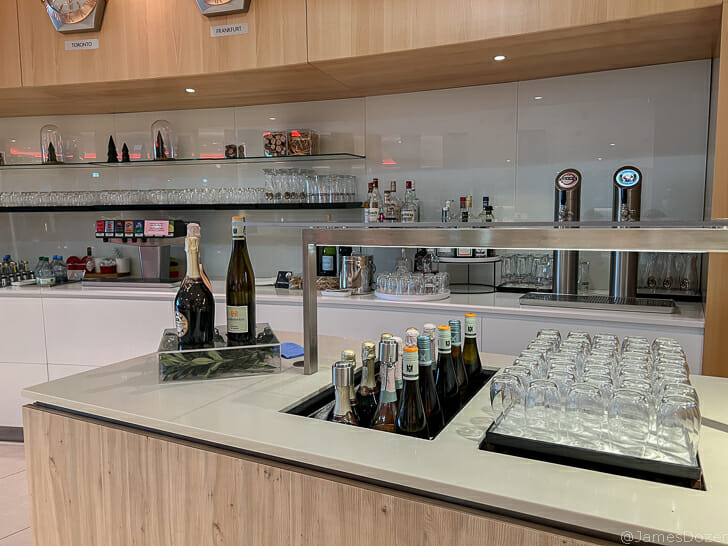 a bar with bottles of wine and glasses