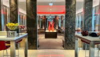 a room with marble walls and red lights