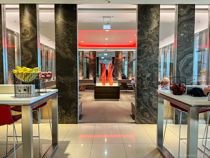 a room with marble walls and red lights