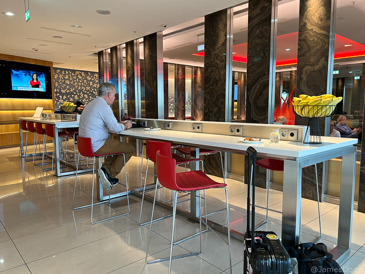 a man sitting at a long table
