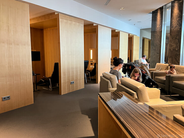 people sitting in chairs in a room