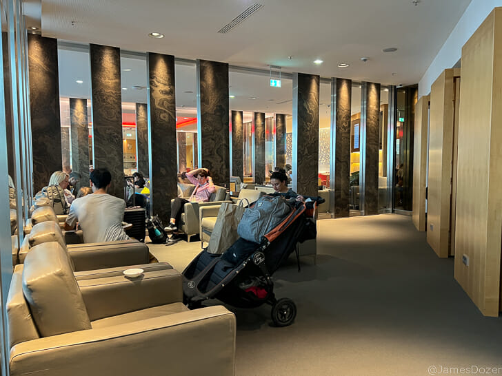 a man sitting in a stroller in a lobby