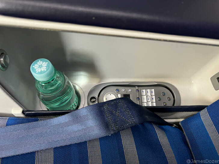 a bottle in a seat belt