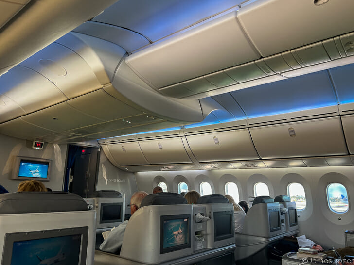 a group of people sitting in an airplane