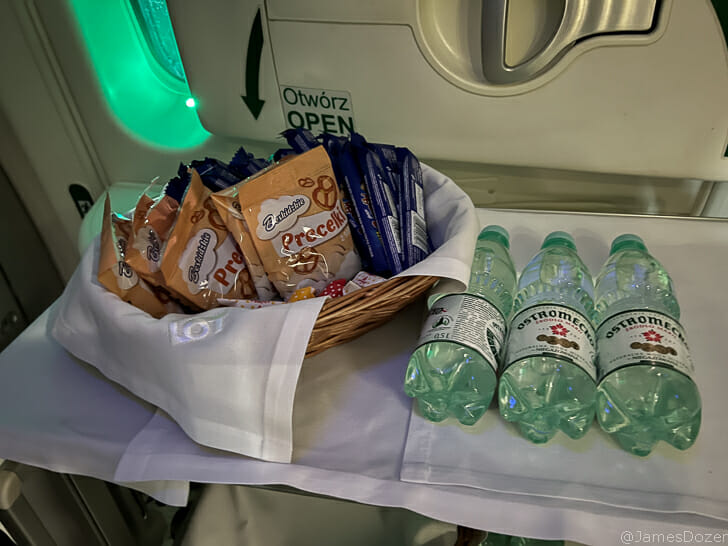 a basket of food and water bottles on a table
