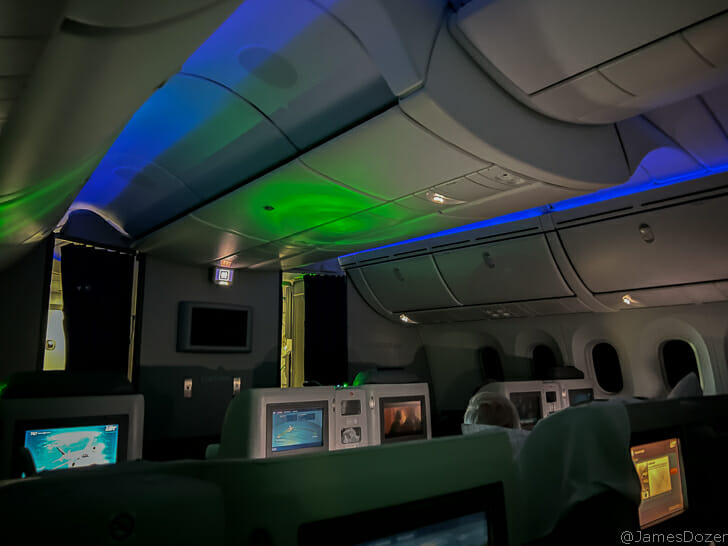 a group of people sitting in an airplane
