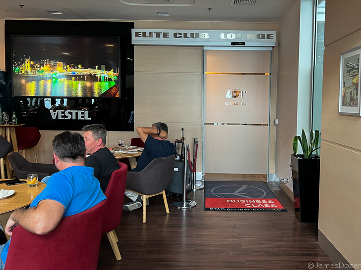 a group of people sitting at a table in a room