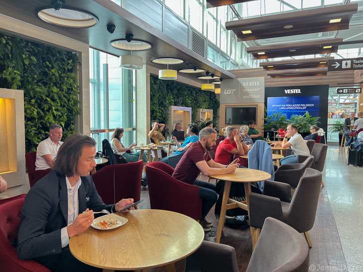 people sitting at tables in a restaurant